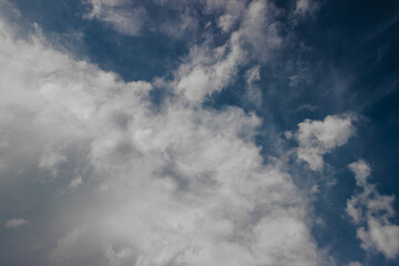 white clouds between the blue sky