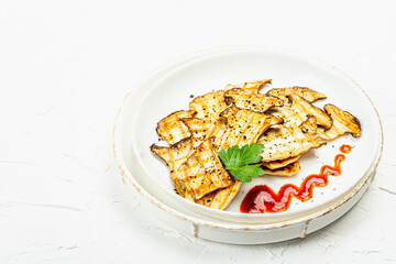 Fried slices Pleurotus eryngii mushrooms with sauce, spices and herbs. Healthy vegan food concept