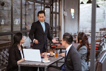 Fototapeta premium portrait of asian business people having an argument during meeting with partner