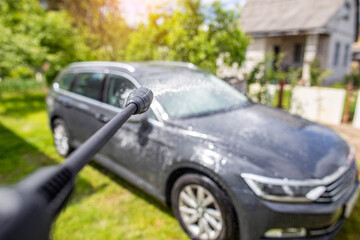 High-tech car wash with car shampoo with gloss and wax for paintwork in nature