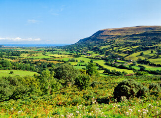 Northeast over Glenariff, one of the nine Glens of Antrim to the Atlantic coast at Red Bay and...