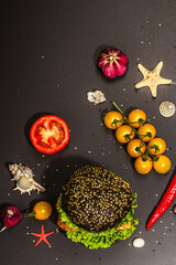 Obraz na płótnie Canvas Homemade fish burger. Fresh ingredients, ripe vegetables, fast food concept