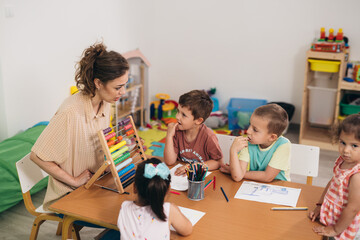 teacher working with kids in day care