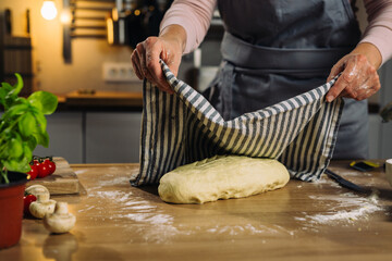 woman preparing bread in her home kitchen