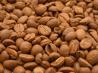 Macro shot of fresh aromatic roasted coffee beans