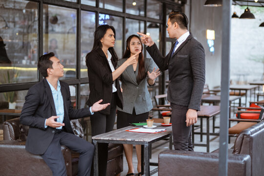 Portrait Of Asian Business People Having An Argument During Meeting With Partner