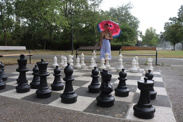 playing a big game of chess in the rain in Vienna