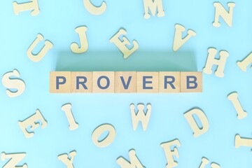 Proverb figure of speech concept in English grammar class lesson. Wooden blocks typography flat lay in blue background.