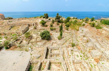 The crusaders' castle in the historic city of Byblos in Lebanon. A view of the western part of the ancient site from the top of the castle and the Mediterranean sea. 