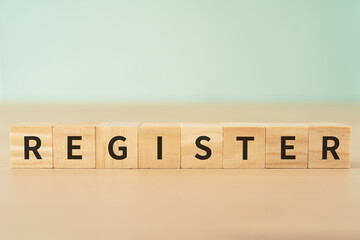 登録のイメージ｜「REGISTER」と書かれたブロック
