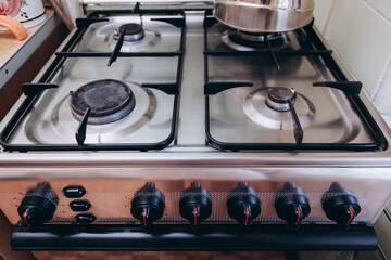 The gas stove is turned off in the kitchen in the apartment