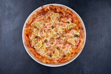 fresh pizza on the white plate