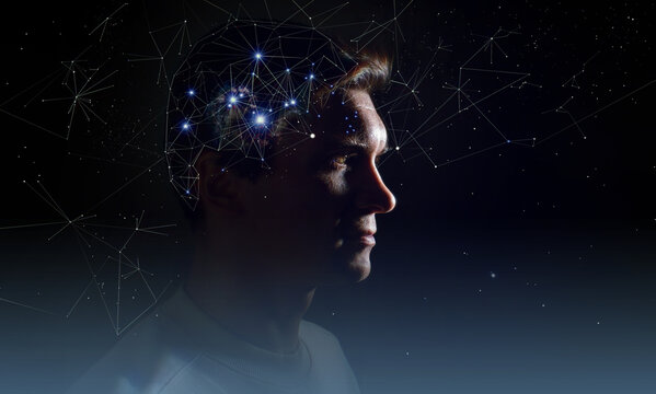 The profile of a thoughtful young man, the concept of brain activity of self-knowledge and personality development. Thinking like stars, the cosmos inside human, background night sky
