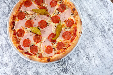 fresh pizza on the white plate