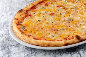 fresh pizza on the white plate
