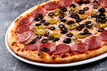 fresh pizza on the white plate