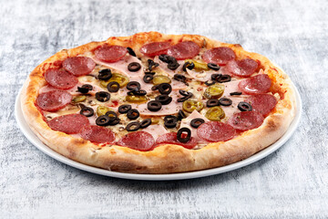 fresh pizza on the white plate