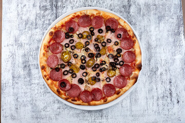 fresh pizza on the white plate