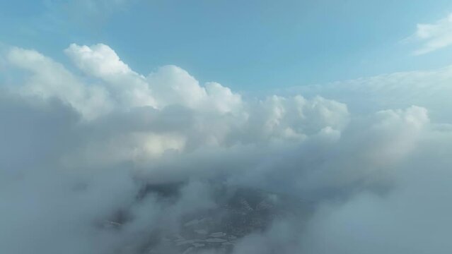 Over the city in the clouds aerila view 4 K Turkey Alanya 