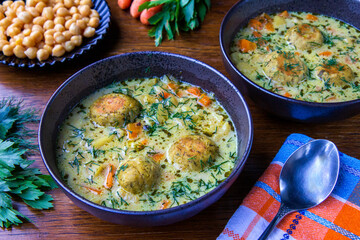 Vegetable and dill soup with chickpea meatballs