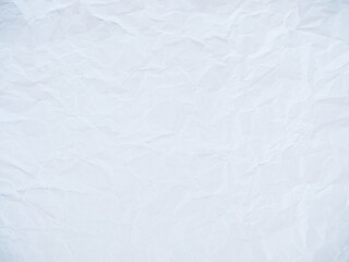 Сrumpled paper with folds and creases as an abstract background