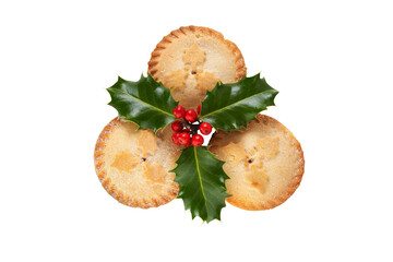 Three Christmas mince pies with holly isolated against a flat background. © Duncan Andison