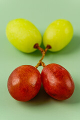 Red and Yellow Grapes on a Green background
