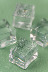 Ice cubes on a Green background