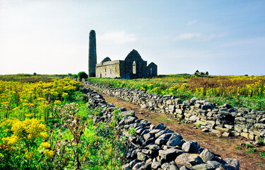 Scattery Island, County Clare, Ireland. Celtic Christian Saint Senan's Cathedral and round tower. Temple Senan in right distance