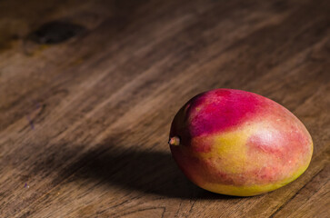 mango fruit on wooden table