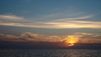 red sunset in the sea, gentle romantic natural background. Unity with nature