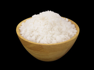 Wooden bowl with sea salt isolated on black background.