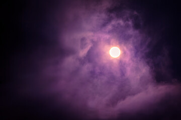 Purple sun and clouds 