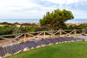 wooden walkways, access to La Barrosa beach in Sancti Petri, Cadiz, Spain