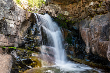 Aster Falls accessible from the South Shore Trailhead at Two Medicine Lake in Glacier National...