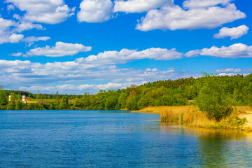 Obraz na płótnie Canvas Beautiful quarry lake dredging pond lake blue turquoise water Germany.