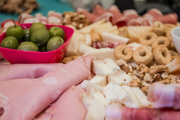 a delicious platter of Italian cold cuts and cheeses, accompanied by olives, honey and taralli