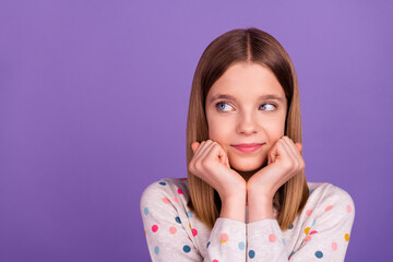 Portrait of adorable minded person arms touch cheekbones look empty space isolated on purple color...