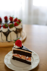 Chocolate cake with strawberry and whipping cream. Homemade bekery concept.