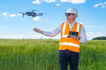 Professional surveyor. Man surveyor launches drone. Topographic survey before construction concept....