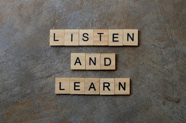 listen and learn text on wooden square, business motivation quotes