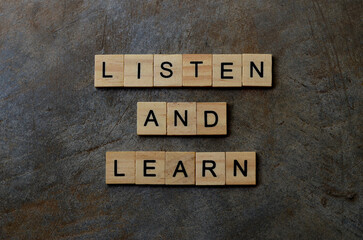 listen and learn text on wooden square, business motivation quotes