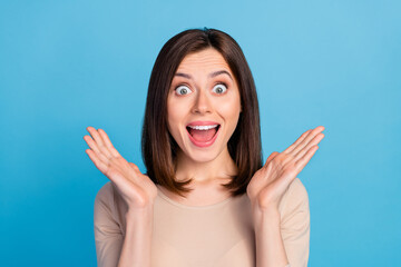 Portrait of impressed overjoyed lady raise opened arms cant believe isolated on blue color background