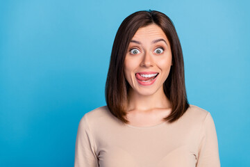 Portrait of satisfied adorable person beaming smile tongue lick teeth isolated on blue color background - obrazy, fototapety, plakaty