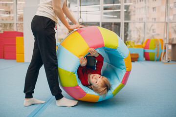 Kids playing in gym at kindergarten or elementary school. Children sport and fitness concept