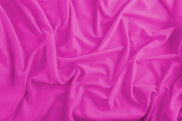 Fuchsia or pink fabric background with waves