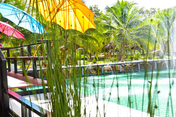 : Colorful umbrellas and fountains to sit and relax for tourists