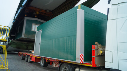 Loading cargo into a cargo plane. Shipment of cargo by a transport company from an airport in...
