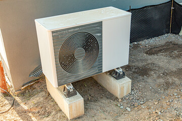 outside module of an heat pump heating unit at a construction site