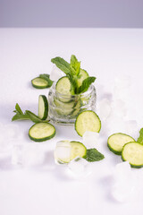 moisturizing cosmetics based on natural extracts of aloe, cucumber and ice in a glass container on a white background